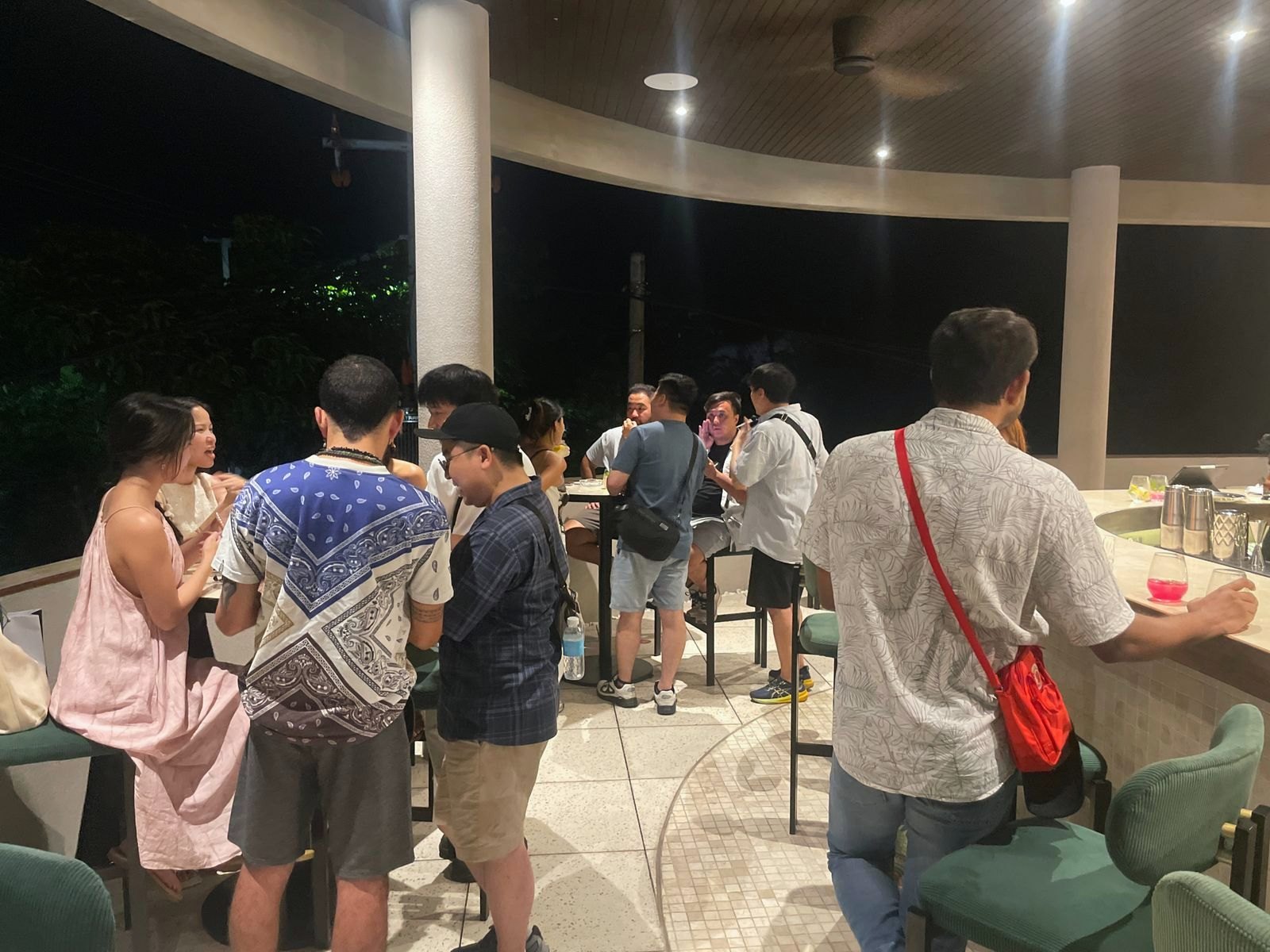 Guests at the curved bar at the Bali Founder × VC Happy Hour