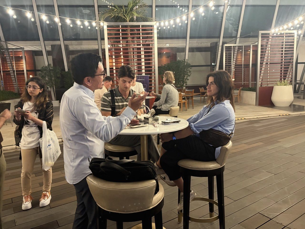 Guests under the string lights at the Dubai Founder × VC Happy Hour